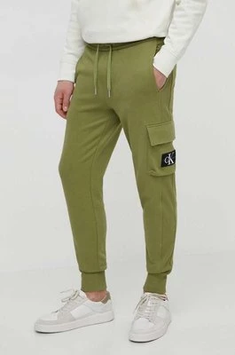 Calvin Klein Jeans spodnie dresowe bawełniane kolor zielony gładkie