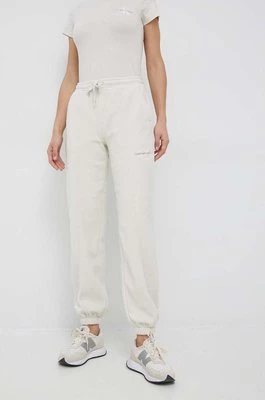 Calvin Klein Jeans spodnie dresowe damskie kolor beżowy z aplikacją