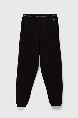 Calvin Klein Jeans spodnie dresowe dziecięce kolor czarny gładkie