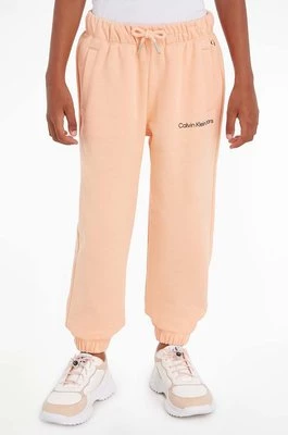 Calvin Klein Jeans spodnie dresowe dziecięce kolor pomarańczowy gładkie