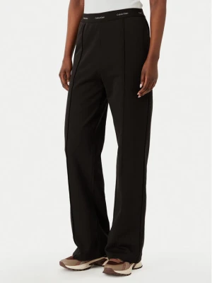 Calvin Klein Jeans Spodnie dresowe LV047G253G Brązowy ciemny Relaxed Fit
