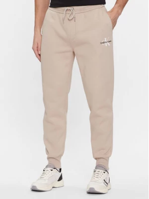 Calvin Klein Jeans Spodnie dresowe Monologo J30J324685 Beżowy Regular Fit