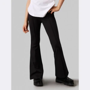 Calvin Klein Jeans Spodnie | flare fit