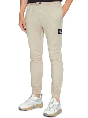 Calvin Klein Spodnie w kolorze beżowym rozmiar: XL