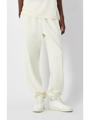 Champion Spodnie dresowe w kolorze kremowym rozmiar: M