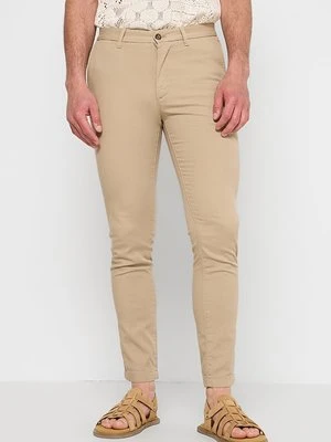 Chinosy Tommy Hilfiger piaskowy