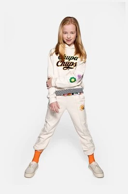 Coccodrillo spodnie dresowe bawełniane dziecięce kolor beżowy z aplikacją