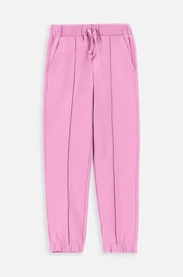 Coccodrillo spodnie dresowe dziecięce kolor różowy z nadrukiem