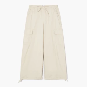 Cropp - Beżowe spodnie baggy z kieszeniami cargo - beżowy