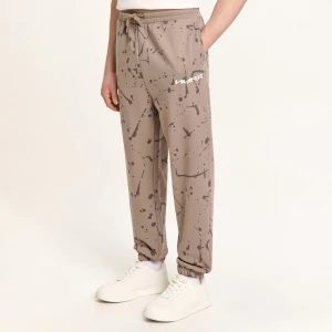 Cropp - Dresowe joggery z nieregularnym nadrukiem all over - beżowy