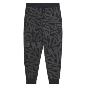 Cropp - Dresowe spodnie z nadrukami all over - czarny