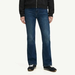Cropp - Granatowe jeansy bootcut z efektem sprania - granatowy