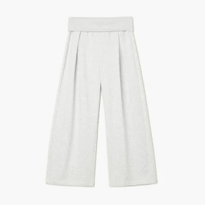 Cropp - Melanżowe spodnie dresowe z podwinięciem - jasny szary