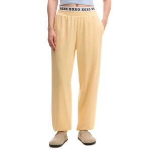 Cropp - Spodnie dresowe z napisem na gumce - kremowy