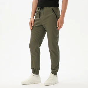 Cropp - Spodnie jogger slim z kieszeniami na zamek - zielony