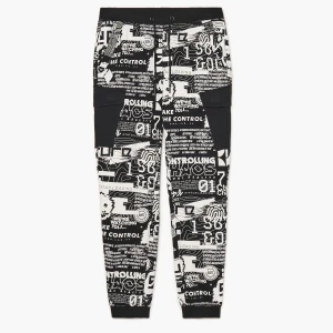 Cropp - Spodnie joggery z nadrukiem all over - biały