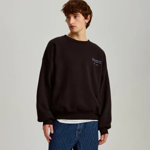 Zdjęcie produktu Czarna bluza oversize z nadrukiem z przodu i na plecach House