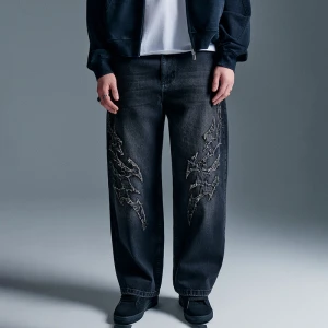 Czarne jeansy baggy fit skater z aplikacjami tribal House