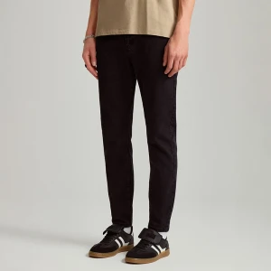 Czarne jeansy carrot fit House