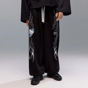 Czarne spodnie dresowe baggy fit z nadrukiem tribal i Hello Kitty House
