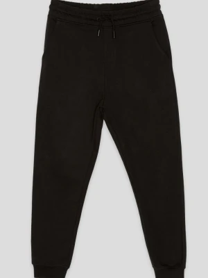 Czarne spodnie dresowe oversize z nadrukiem Reporter