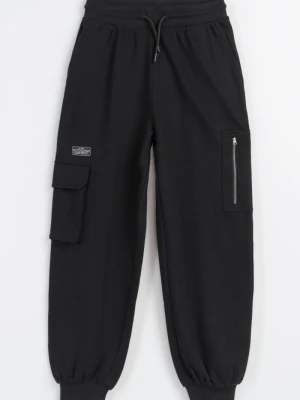 Czarne spodnie dresowe oversize z naszywanymi kieszeniami na nogawkach Reporter