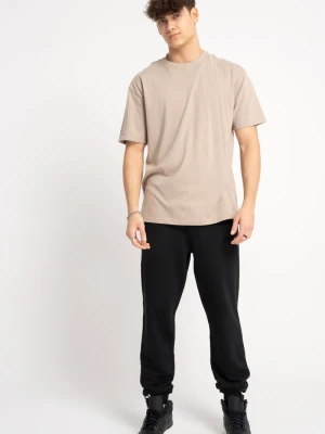 Spodnie chłopięce dresowe regular z nadrukiem na nogawce Reporter