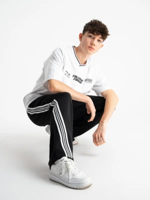 Czarne spodnie dresowe WIDE LEG z kontrastowymi paskami na nogawkach Reporter