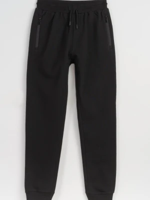 Czarne spodnie dresowe z kieszeniami zapinanymi na zamek Reporter