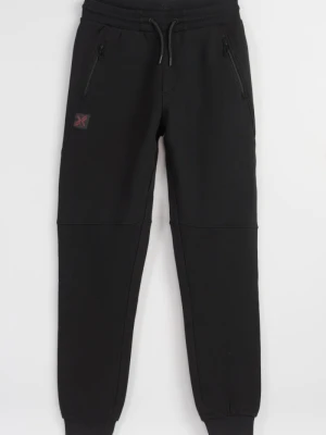 Czarne spodnie dresowe z modnymi cięciami Reporter
