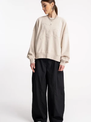 Czarne spodnie tkaninowe z modnymi cięciami Reporter