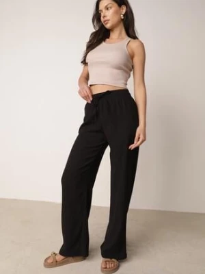 Czarne Szerokie Spodnie z Teksturalnej Tkaniny z Wiązaniem w Pasie Agatia glo-story