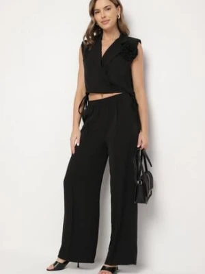 Czarny Komplet Kopertowa Bluzka z Kwiatową Broszką i Szerokie Spodnie Reavilia allyson