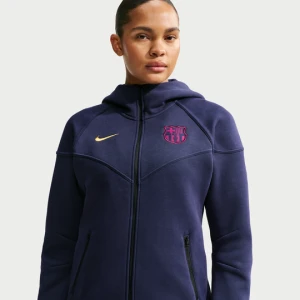 Damska bluza piłkarska z kapturem i zamkiem na całej długości Nike FC Barcelona Tech Fleece Windrunner - Niebieski