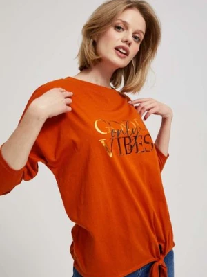 Damska bluzka pomarańczowa z długim rękawem i wiązaniem Moodo