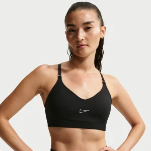 Damski stanik sportowy z regulacją i wkładkami zapewniający lekkie wsparcie Nike Indy - Czerń