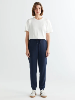 Damskie granatowe spodnie dresowe z taśmą po bokach GANT
