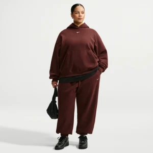 Damskie spodnie o kroju oversize z wysokim stanem i ściągaczami Nike Studio Fleece Medium Weight (duże rozmiary) - Fiolet