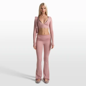 Damskie spodnie z rozszerzanymi nogawkami i wywijanym pasem NikeSKIMS Matte - Różowy