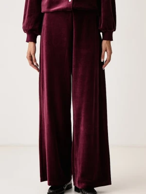 DKNY spodnie dresowe damskie welurowe bordowy