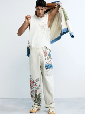 Długie spodnie w kwiaty Desigual