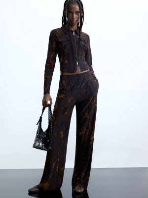 Długie spodnie z flokowaniem Desigual