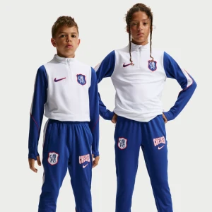 Dzianinowe spodnie piłkarskie dla dużych dzieci Nike Dri-FIT Chelsea F.C. Strike (wersja trzecia) - Niebieski