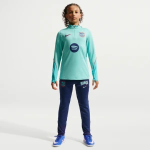 Dzianinowe spodnie piłkarskie dla dużych dzieci Nike Dri-FIT FC Barcelona Strike (wersja trzecia) - Niebieski