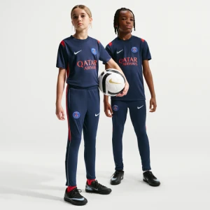 Dzianinowe spodnie piłkarskie dla dużych dzieci Nike Dri-FIT Paris Saint-Germain Academy Pro - Niebieski