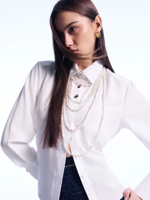 Elegancka biała koszula z guzikami w złotym kolorze TARANKO