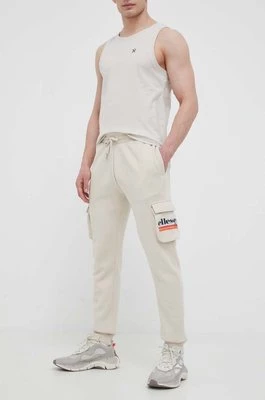 Ellesse spodnie dresowe kolor beżowy z nadrukiem