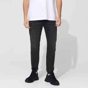 Grafitowe jeansowe joggery z przetarciami House