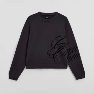 Grafitowy sweter boxy z ciemnym nadrukiem House ciemnoszary