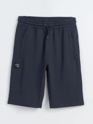 Granatowe krótkie spodenki dresowe REGULAR z naszywką Reporter